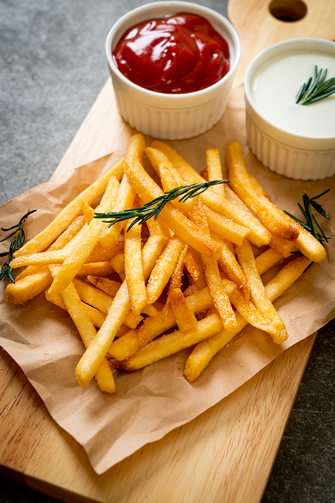 French fries or potato chips with sour cream and ketchup